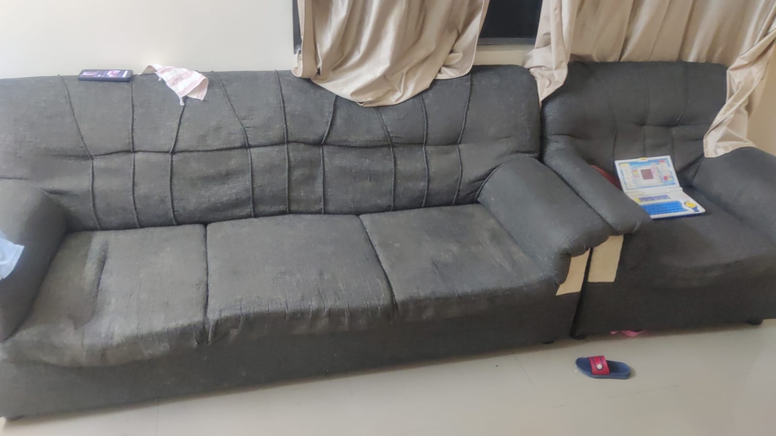Damaged sofa before repair